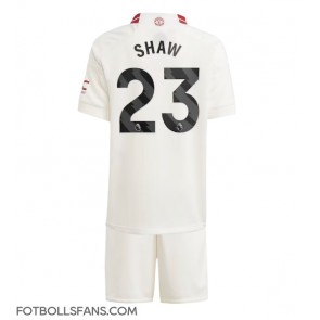 Manchester United Luke Shaw #23 Replika Tredje Tröja Barn 2023-24 Kortärmad (+ Korta byxor)